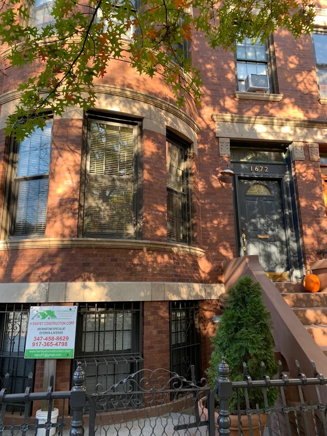H Enayet inspecting brownstone masonry on a Brooklyn project